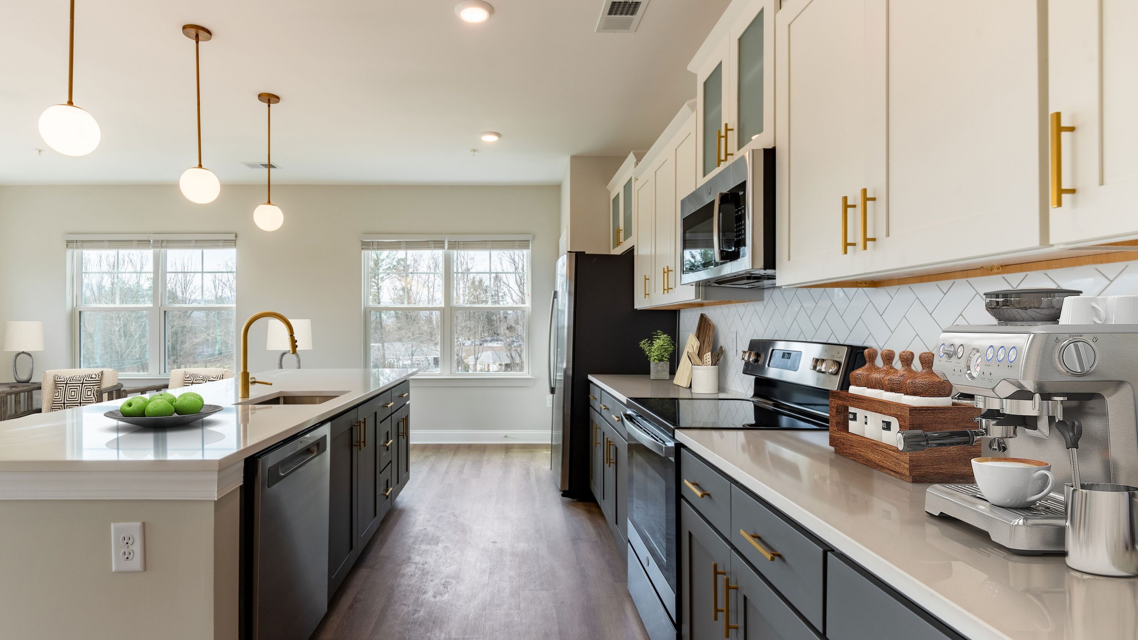 Hawthorne at Haywood modern apartment kitchen with kitchen island, quartz countertops, stainless steel appliances, 9ft ceilings